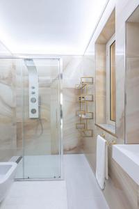 a bathroom with a shower and a sink at Sea Elegance in Oliveri