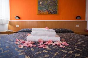 Postel nebo postele na pokoji v ubytování Hotel Benacus