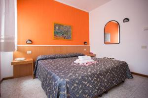 Postel nebo postele na pokoji v ubytování Hotel Benacus