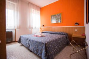 Postel nebo postele na pokoji v ubytování Hotel Benacus