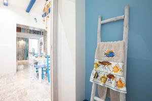 a ladder in a childs room with a blue wall at Sea Elegance in Oliveri