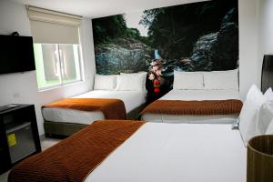Katil atau katil-katil dalam bilik di Hotel Kahvé