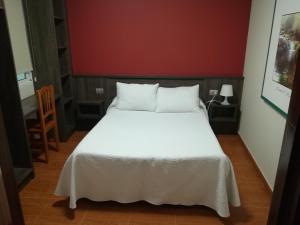 Pensión Restaurante Casa Camiño II客房内的一张或多张床位