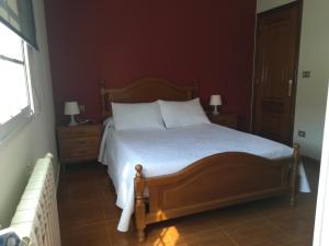 Pensión Restaurante Casa Camiño II客房内的一张或多张床位