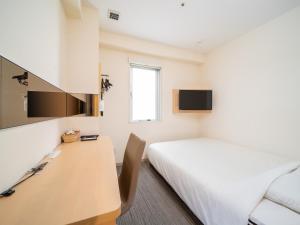 Postel nebo postele na pokoji v ubytování Super Hotel Asakusa