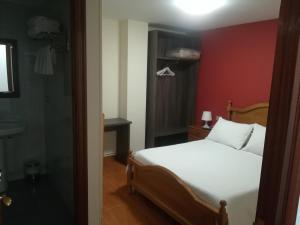 Pensión Restaurante Casa Camiño II客房内的一张或多张床位