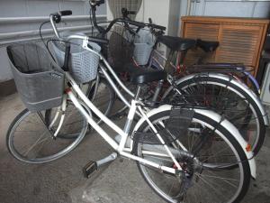 
bicycles are parked in a garage at Hotel New Takahashi Takezono in Tsukuba

