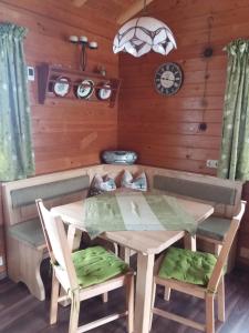 a dining room with a table and chairs at Ferienhaus Altenstrasser in Philippsreut