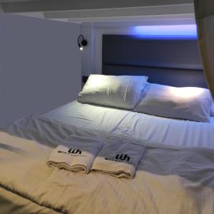 Letto o letti in una camera di Wink at Mosque Street