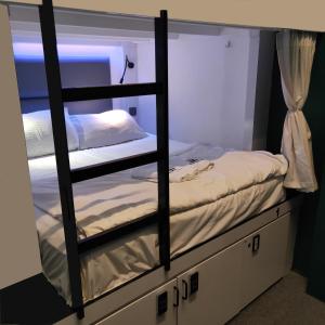 Letto o letti in una camera di Wink at Mosque Street
