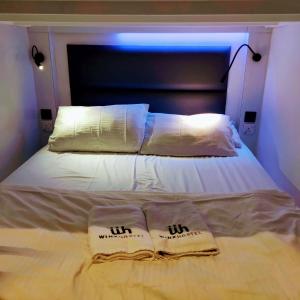 Letto o letti in una camera di Wink at Mosque Street