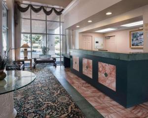 a large room with a lobby with a reception desk at Economy Inn & Suites in Shreveport