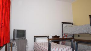 Televízia a/alebo spoločenská miestnosť v ubytovaní Residence Praetorium Maiella Park