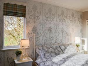 A bed or beds in a room at The Pavilion 