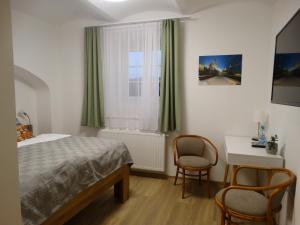 Postel nebo postele na pokoji v ubytování Hotel Garni Villa Areka