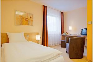 Postel nebo postele na pokoji v ubytování Hotel Fuxxbau
