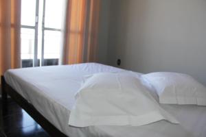 Ein Bett oder Betten in einem Zimmer der Unterkunft Polonini Apartamento