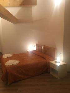 Postel nebo postele na pokoji v ubytování Albergo Croce d'Aune