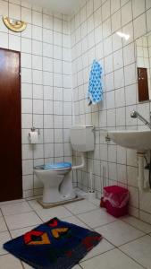 a bathroom with a toilet and a sink at FerienHaus Elim in Morbach +12 photos
