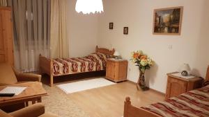 Ein Bett oder Betten in einem Zimmer der Unterkunft Ingrid Panzió