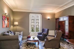 a living room with two couches and a coffee table at Bcn Paseo De Gracia Rocamora Apartment in Barcelona