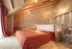 Postel nebo postele na pokoji v ubytování Hotel Cristallo