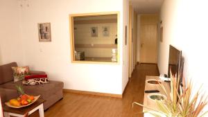 a living room with a couch and a table at Holiday home close to golden mile in Playa de las Americas