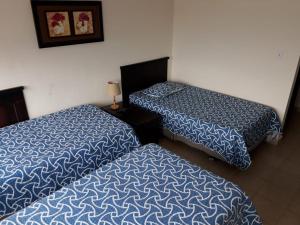 Letto o letti in una camera di Hotel Doral