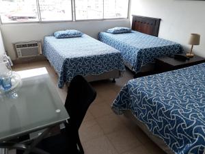 Letto o letti in una camera di Hotel Doral