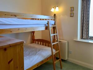 A bunk bed or bunk beds in a room at Farne Haven 