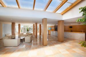 a view of the lobby of a building with a skylight at Maistra Select Pineta Hotel in Vrsar