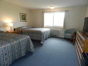 
A bed or beds in a room at C-Way Resort
