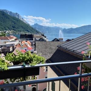 a view of the lake from the balcony of a building at Atelier Apartment with Traunsee Lake view in Gmunden