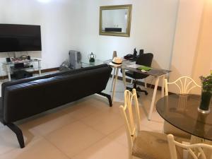 a living room with a couch and a table at Edificio California en Centro Historico in Lima