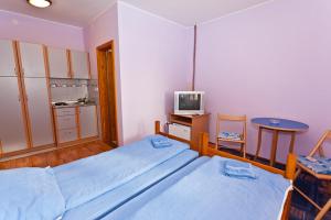 Voodi või voodid majutusasutuse Vila Paun toas