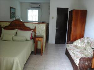 Postelja oz. postelje v sobi nastanitve Firefly Beach Cottages
