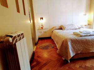 Postel nebo postele na pokoji v ubytování Reina Sofia, !Un lugar comodo y bello para compartir!