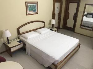 Postel nebo postele na pokoji v ubytování Hotel Sagres