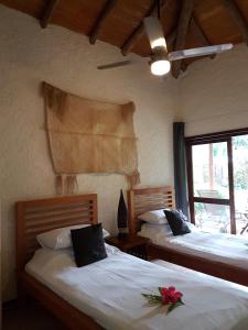Postel nebo postele na pokoji v ubytování Paradise Cove Resort