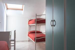Postel nebo postele na pokoji v ubytování Hotel Giove dipendenza Hotel Fiamma