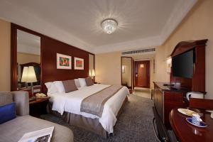 Voodi või voodid majutusasutuse Hotel Royal Macau toas
