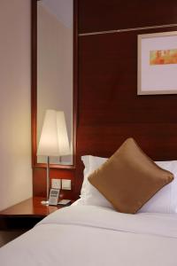 Ліжко або ліжка в номері Hotel Royal Macau