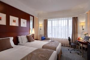 Voodi või voodid majutusasutuse Hotel Royal Macau toas