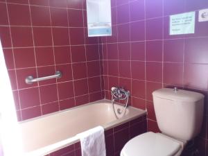 Ein Badezimmer in der Unterkunft Hotel Peninsular