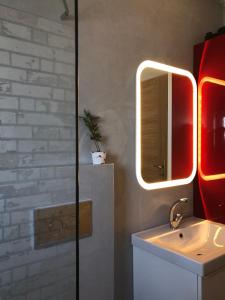 a bathroom with a sink and a mirror at Blue Sky in Frangokastello