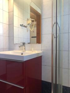 a bathroom with a sink and a mirror at Blue Sky in Frangokastello