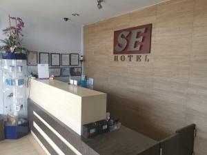a store front with a sign on a wall at SE Hotel in Butterworth