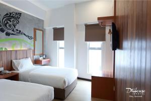 Postel nebo postele na pokoji v ubytování De House Hotel