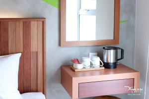 Postel nebo postele na pokoji v ubytování De House Hotel