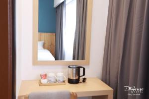 Postel nebo postele na pokoji v ubytování De House Hotel